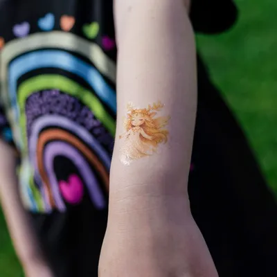 Child-themed golden angel tattoo