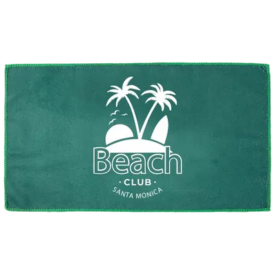 A custom beach towel in green featuring a white tropical design and the words 'Beach Club - Santa Monica' centralized on the fabric.