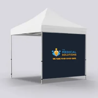 A custom-branded event tent with 'MEDICAL SOLUTIONS WE TAKE YOUR GOOD CARE' on its backdrop, likely for outdoor promotional or medical outreach activities.